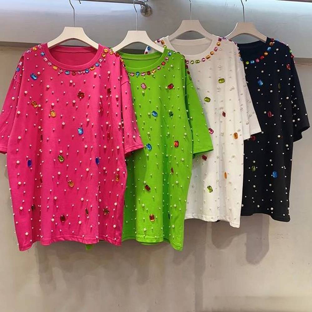 chic female pullover shirt with complex stitching designs and glittery