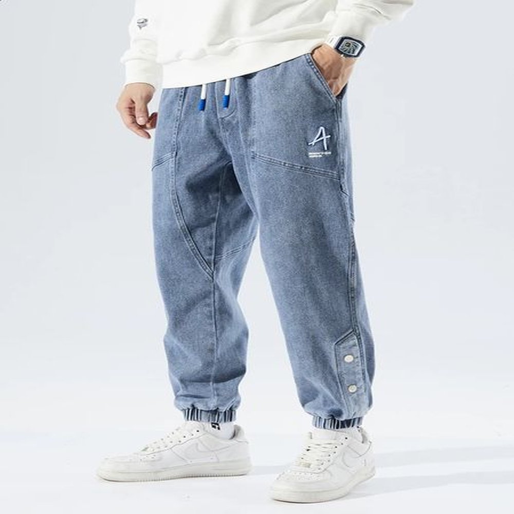 Spring and autumn plus size pocket jeans mens hip-hop streetwear harem pants fashionable embroidery elastic cotton casual jogging jeans 8XL
