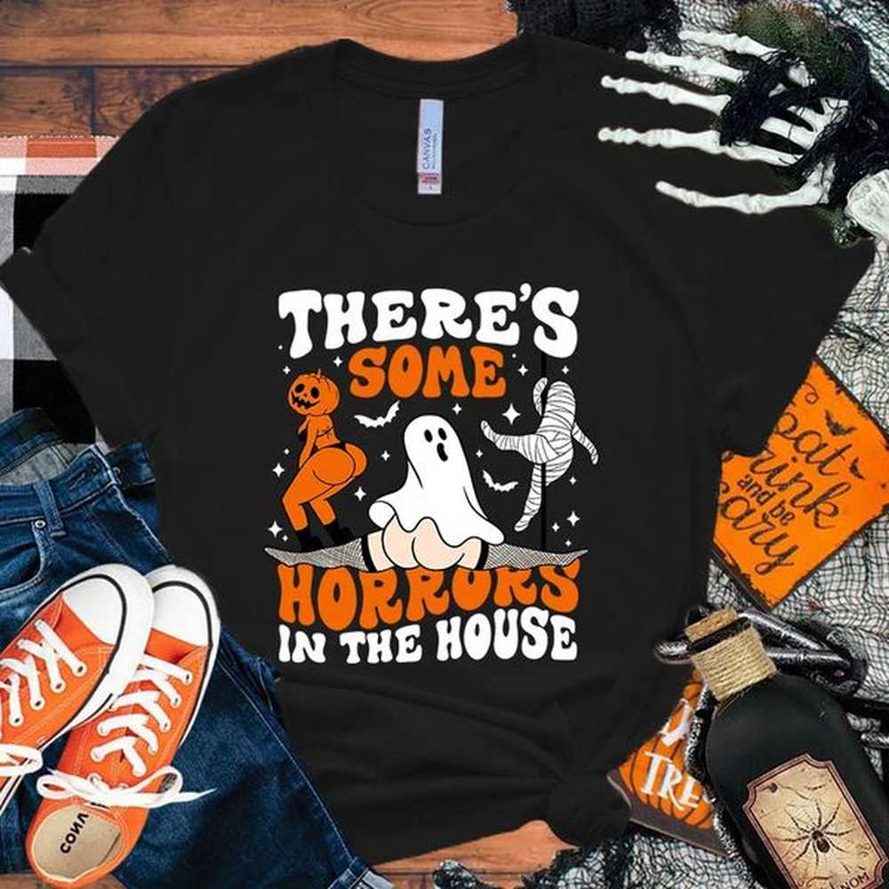 There are some horror printed T-shirts in the Halloween house summer casual loose T-shirts womens Harajuku shirts 240829