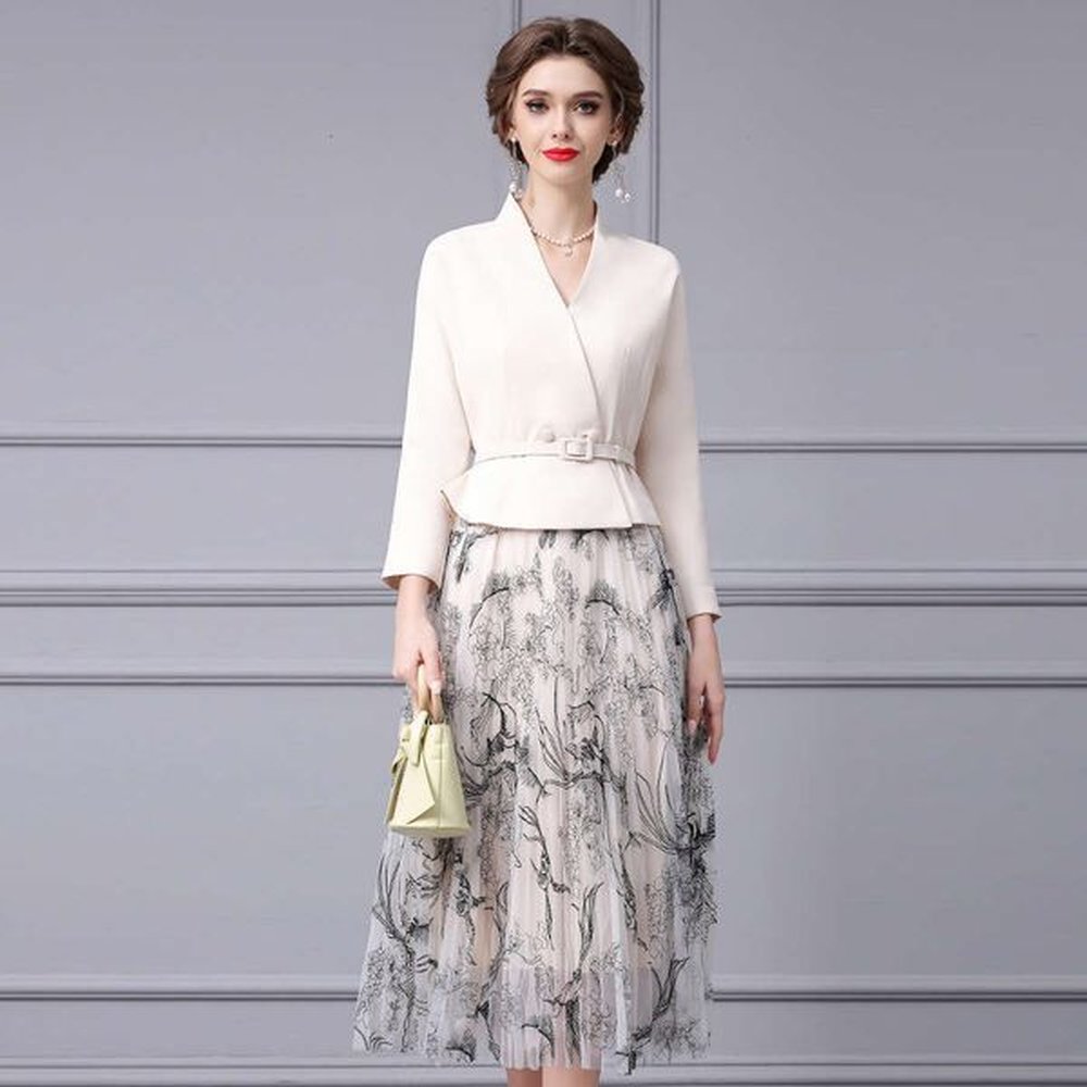 vneck waist cinched suit jacket paired with ink printed pleated